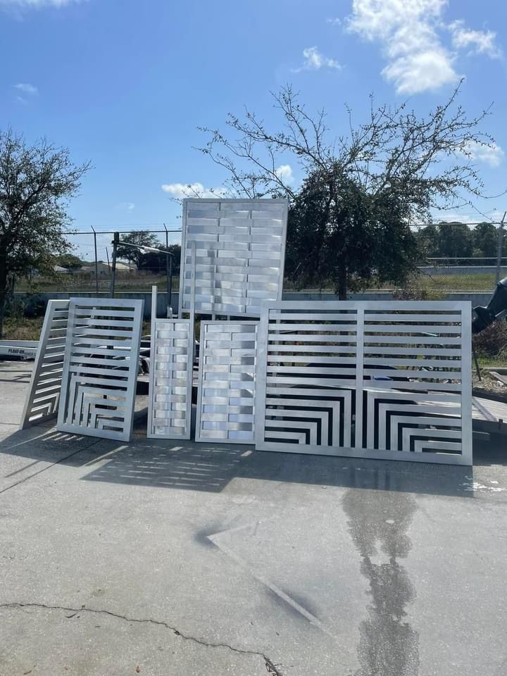 Custom-fabricated aluminum fence panels with geometric designs