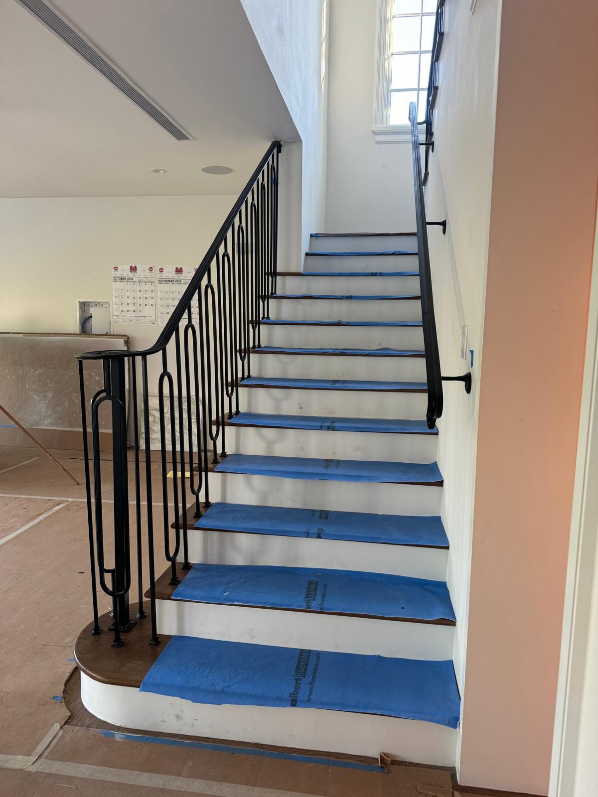 Custom steel stair with ornate metalwork